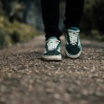 일상 속 만성피로, 작지만 꾸준한 변화가 해답 a person standing on a gravel road with their shoes on
