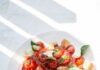 변화하는 식단 트렌드, 일상 속 건강한 습관으로 실천하기 sliced tomato and green leaf vegetable on white ceramic plate
